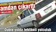 Otomobil kullanırken ayaklarını camdan çıkarttı