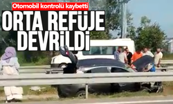 Kontrolden çıkan otomobil orta refüje devrildi