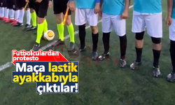 Futbolculardan protesto: Maça lastik ayakkabıyla çıktılar!