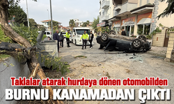 Taklalar atarak hurdaya dönen otomobilden burnu kanamadan çıktı