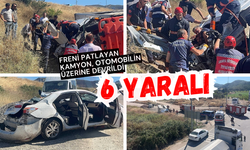 Freni patlayan kamyon, otomobilin üzerine devrildi