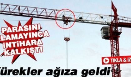 Parasını alamayınca vincin tepesine çıktı