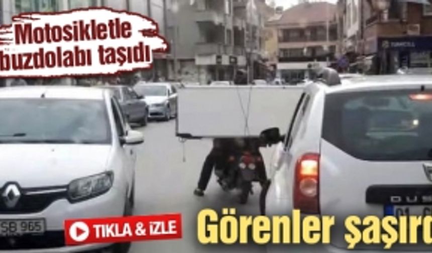 Motosikletle buzdolabı taşıdı